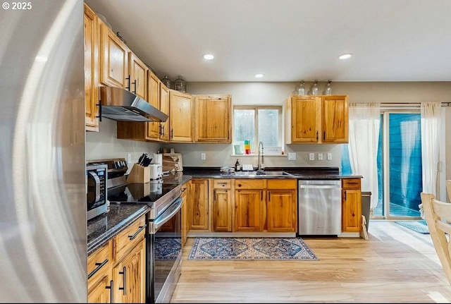 65121 E Lupine Dr, Rhododendron, OR 97049 - kitchen with stainless steel appliances, under cabinet range hood, a sink, light wood-style floors, and recessed lighting