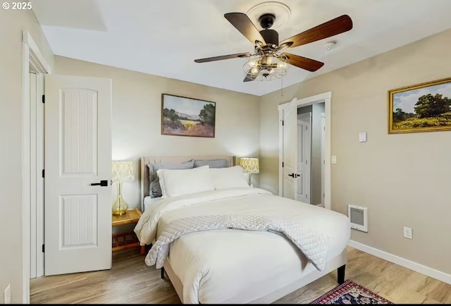 65121 E Lupine Dr, Rhododendron, OR 97049 - bedroom with light wood-style flooring, baseboards, and ceiling fan