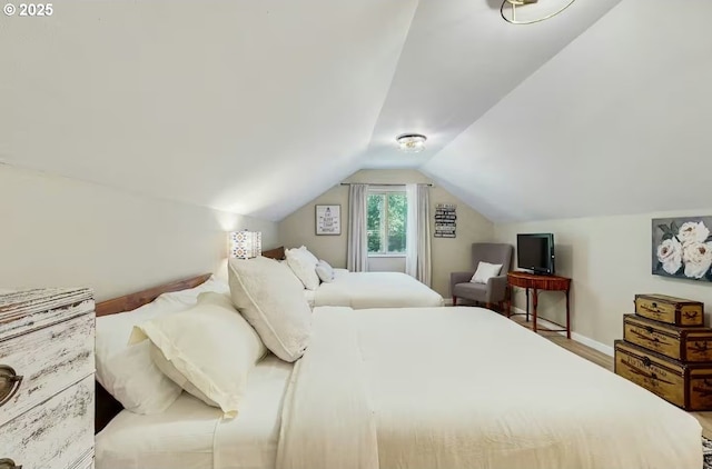 65121 E Lupine Dr, Rhododendron, OR 97049 - bedroom with lofted ceiling, baseboards, and wood finished floors