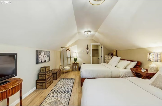 65121 E Lupine Dr, Rhododendron, OR 97049 - bedroom with light wood-style floors, vaulted ceiling, and baseboards