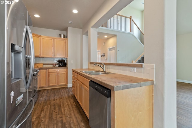 5779 NE Voyage Way, Lincoln City, OR 97367 - kitchen with light brown cabinets, sink, decorative backsplash, tile counters, and stainless steel appliances