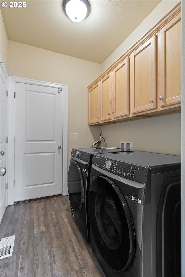 5779 NE Voyage Way, Lincoln City, OR 97367 - washroom featuring dark hardwood / wood-style flooring, cabinets, and washing machine and clothes dryer