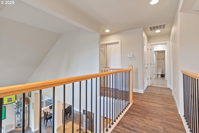 5779 NE Voyage Way, Lincoln City, OR 97367 - hall featuring vaulted ceiling and hardwood / wood-style flooring