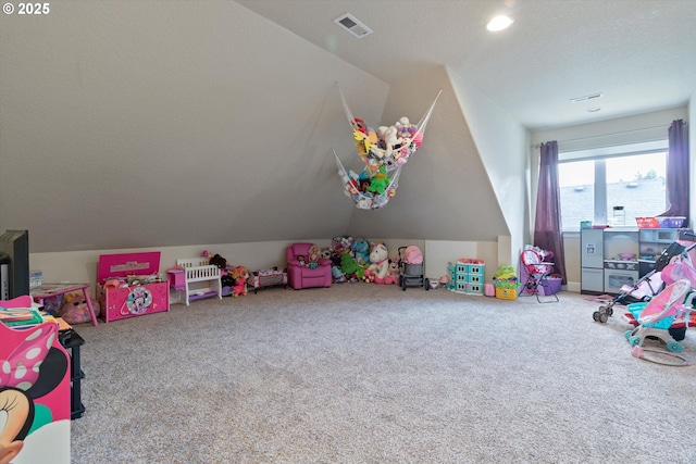 5779 NE Voyage Way, Lincoln City, OR 97367 - game room with carpet flooring, a textured ceiling, and vaulted ceiling