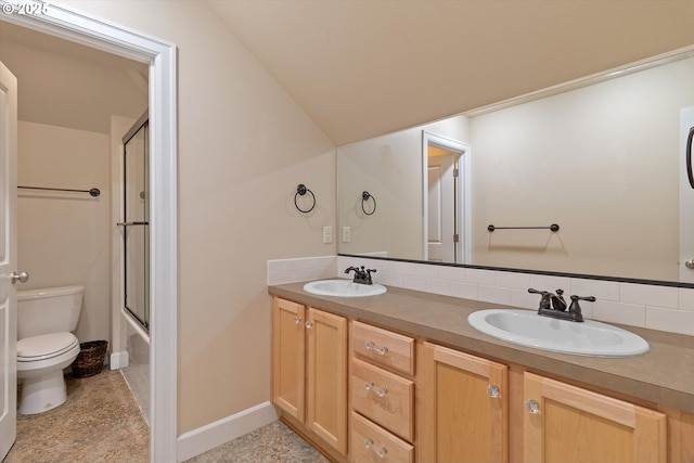 5779 NE Voyage Way, Lincoln City, OR 97367 - full bathroom with tasteful backsplash, bath / shower combo with glass door, vanity, vaulted ceiling, and toilet