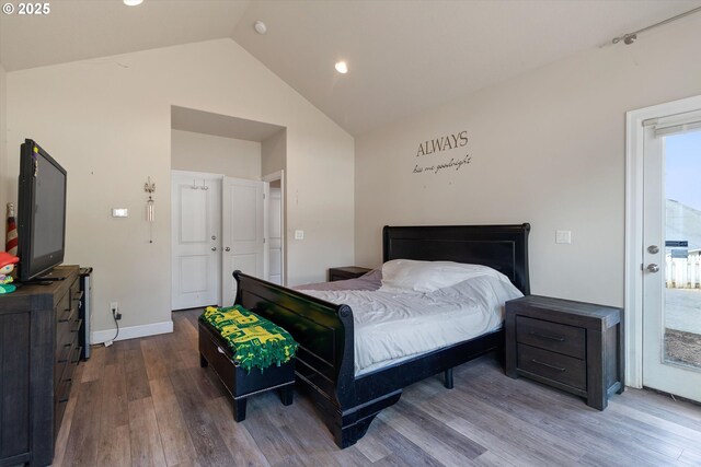 5779 NE Voyage Way, Lincoln City, OR 97367 - bedroom with access to exterior, lofted ceiling, and hardwood / wood-style flooring