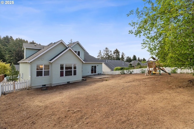 5779 NE Voyage Way, Lincoln City, OR 97367 - rear view of house featuring a playground