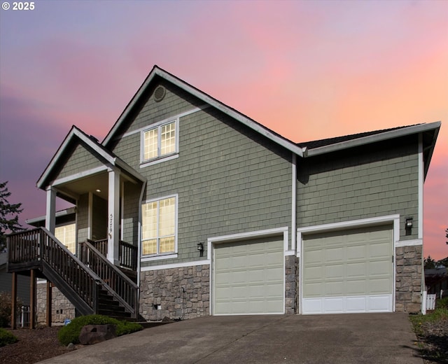 5779 NE Voyage Way, Lincoln City, OR 97367 - view of front facade with a porch and a garage