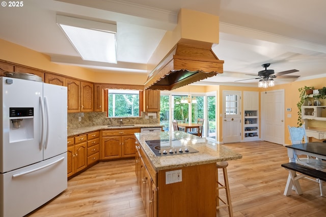 840 Springhill Dr, Albany, OR 97321 - kitchen featuring white appliances, light wood-style flooring, brown cabinets, decorative backsplash, and crown molding