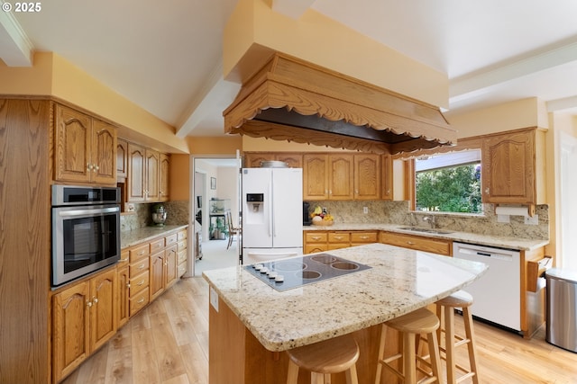 840 Springhill Dr, Albany, OR 97321 - kitchen with white appliances, tasteful backsplash, light wood-style flooring, and light stone countertops