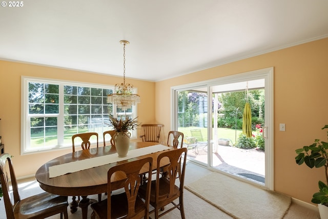 840 Springhill Dr, Albany, OR 97321 - dining room featuring a chandelier, ornamental molding, healthy amount of natural light, and carpet flooring
