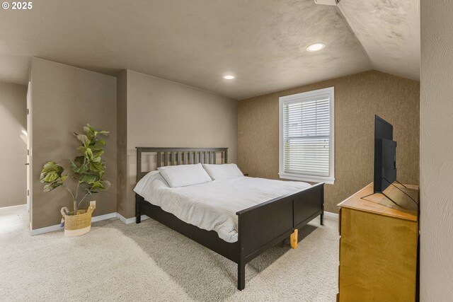 carpeted bedroom with baseboards, recessed lighting, and lofted ceiling