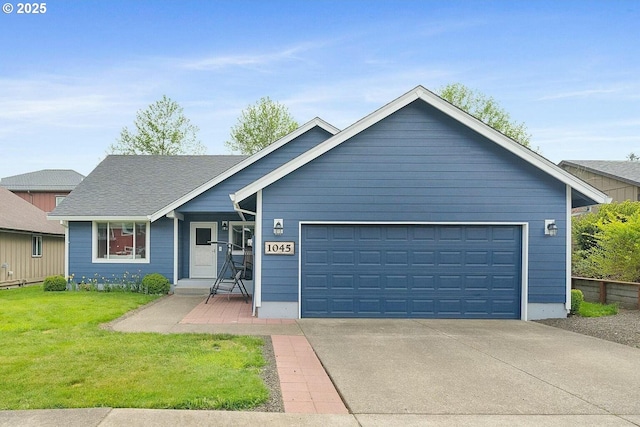 view of front facade featuring a front yard and a garage