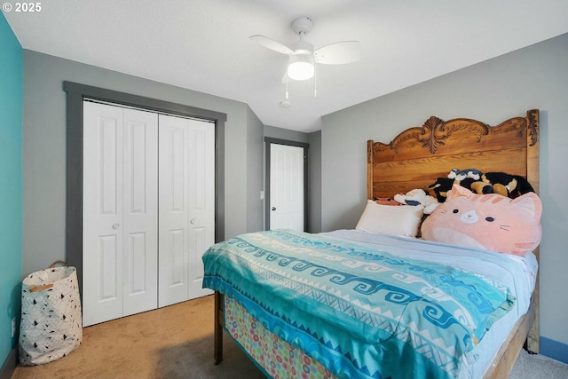 carpeted bedroom featuring a closet and ceiling fan