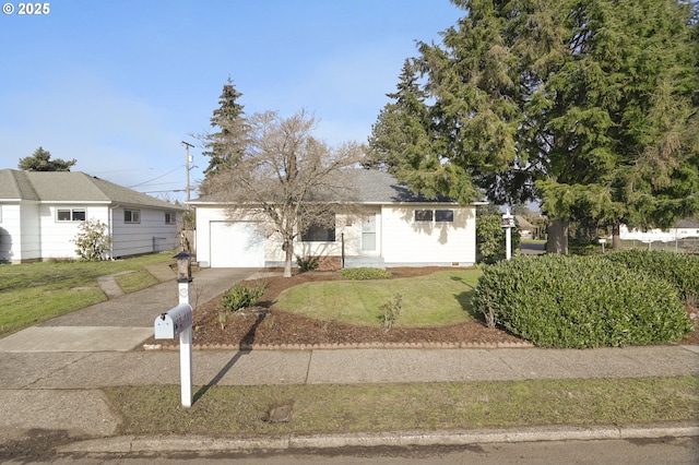 ranch-style home featuring a garage and a front yard