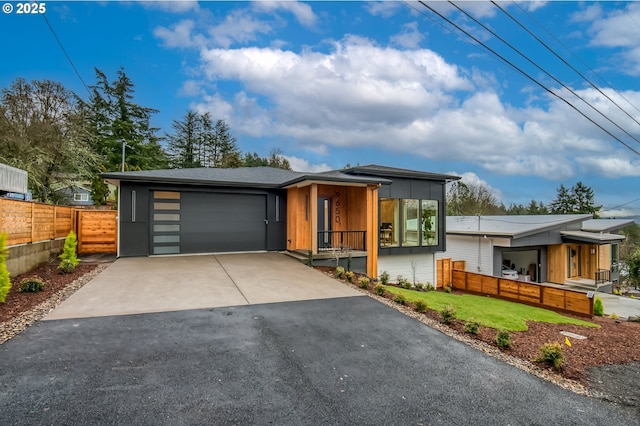 contemporary house with a front lawn and a garage