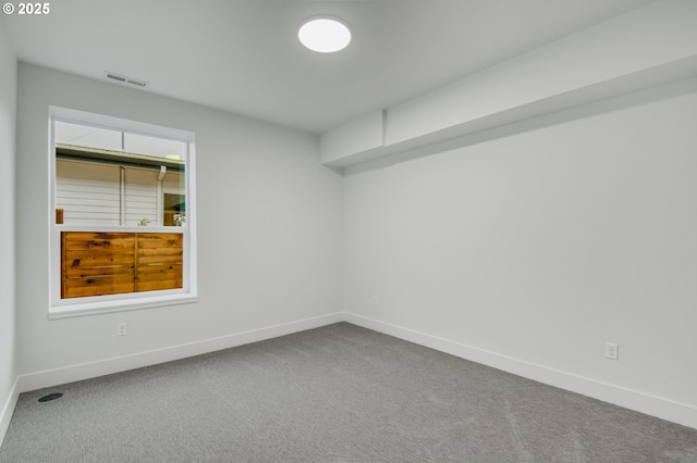 empty room featuring carpet floors