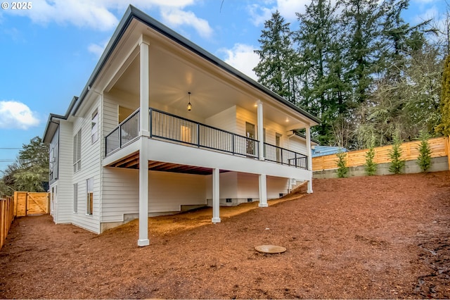 rear view of property with a balcony