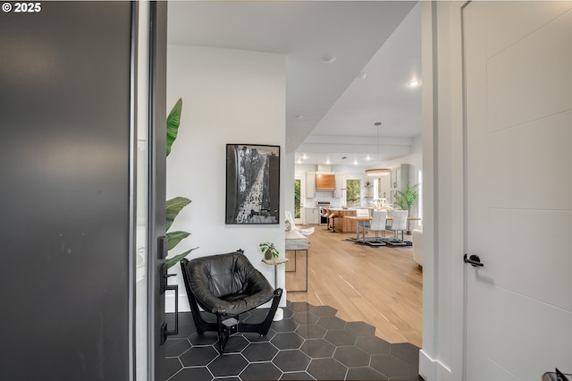 hall with dark hardwood / wood-style flooring