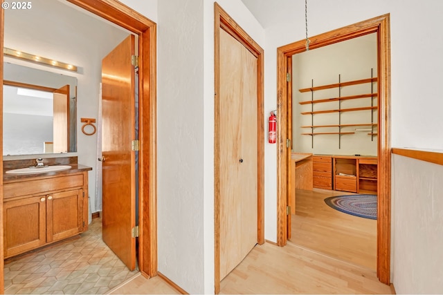 25498 Butler Rd, Junction City, OR 97448 - hall featuring a sink and light wood-style flooring
