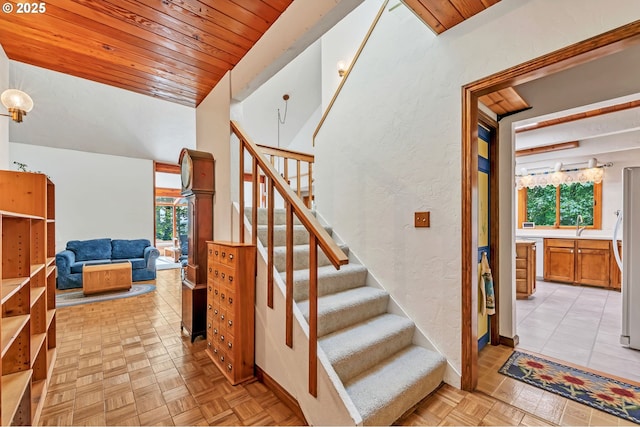 25498 Butler Rd, Junction City, OR 97448 - stairs featuring plenty of natural light, wood ceiling, and a textured wall