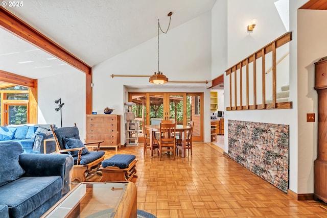 25498 Butler Rd, Junction City, OR 97448 - living area with healthy amount of natural light, high vaulted ceiling, and stairs