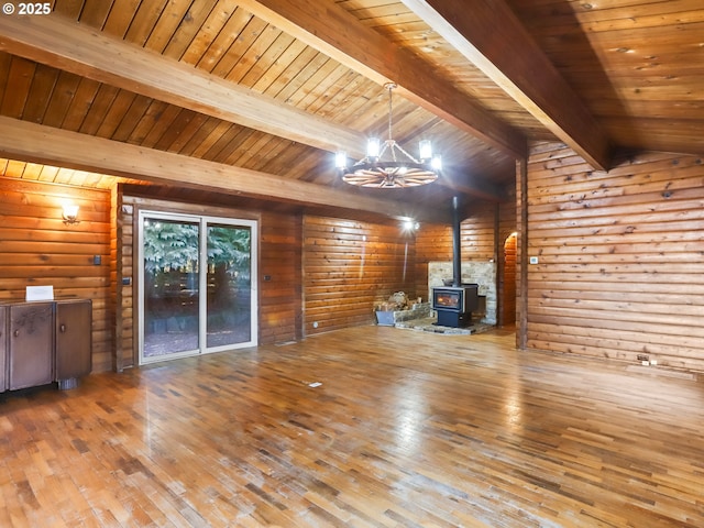29975 E Meissner Rd, Deer Island, OR 97054 - unfurnished living room with hardwood / wood-style floors, a wood stove, a chandelier, wooden ceiling, and wood walls