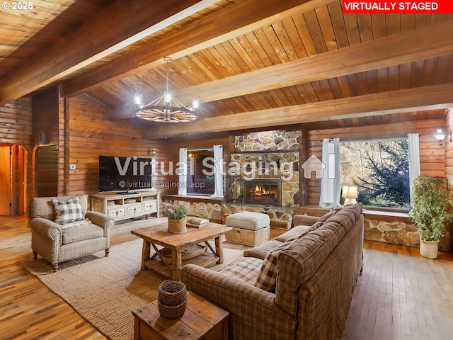 29975 E Meissner Rd, Deer Island, OR 97054 - living room with a chandelier, wood walls, hardwood / wood-style flooring, wooden ceiling, and a stone fireplace