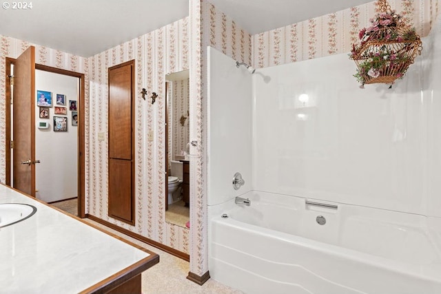 8050 SW 103rd Ave, Beaverton, OR 97008 - bathroom featuring wallpapered walls, toilet, shower / bath combination, and vanity