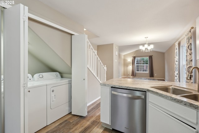 kitchen with sink, dishwasher, white cabinetry, independent washer and dryer, and decorative light fixtures