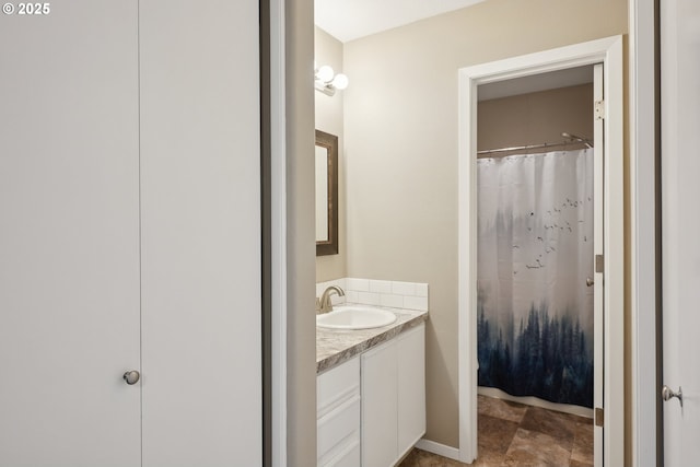 bathroom featuring vanity and a shower with shower curtain