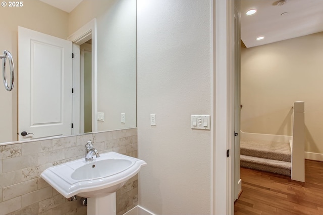 bathroom with sink and hardwood / wood-style flooring