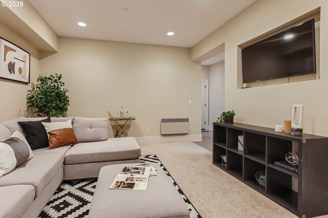 living room featuring carpet flooring, recessed lighting, and baseboards