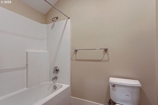 bathroom featuring toilet and  shower combination