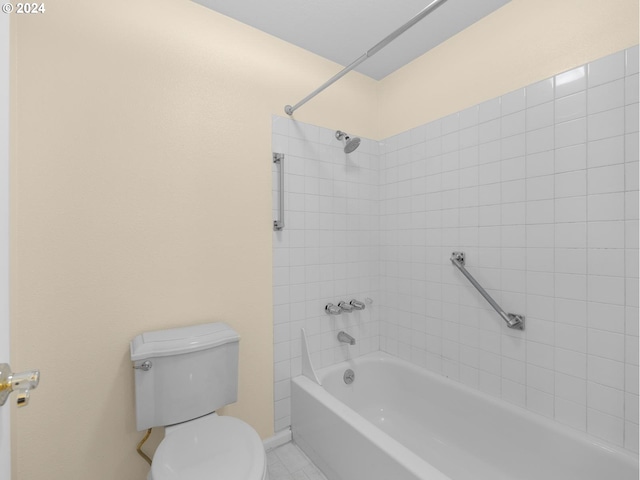 full bathroom featuring washtub / shower combination, baseboards, and toilet