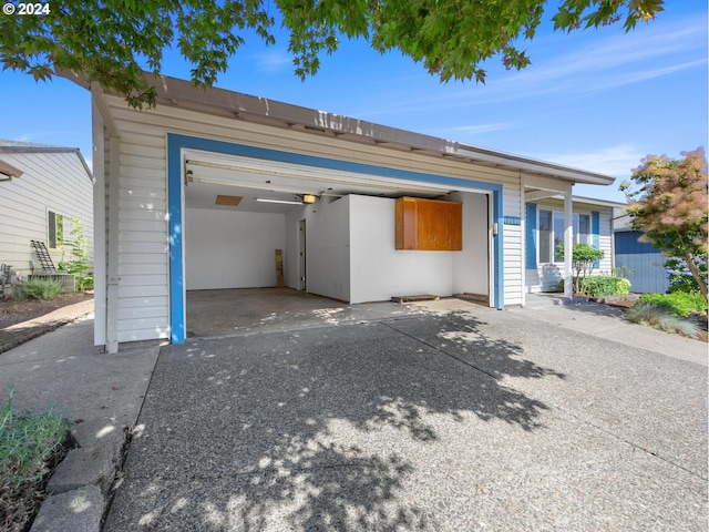 garage with concrete driveway