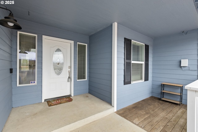 property entrance with covered porch