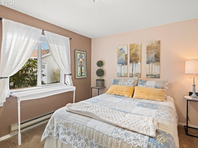 bedroom with a baseboard heating unit, carpet flooring, baseboards, and a textured ceiling