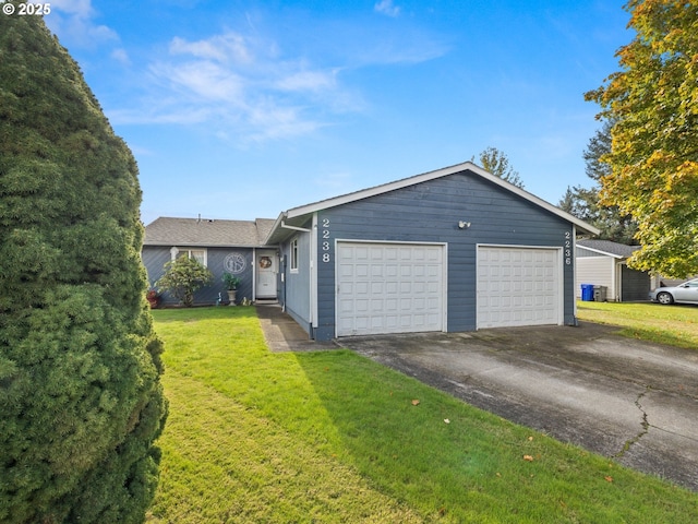 ranch-style home with a front lawn and an attached garage