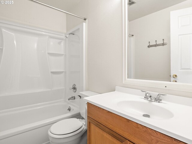 full bath featuring vanity, toilet, washtub / shower combination, and visible vents