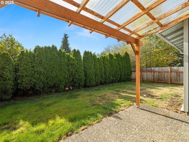 view of yard with a patio and fence