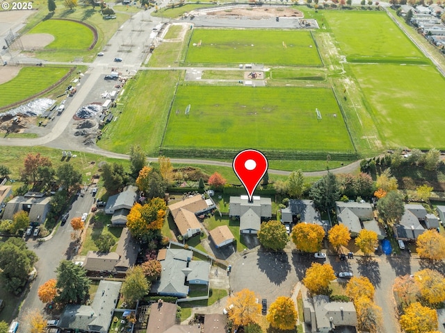 birds eye view of property with a residential view