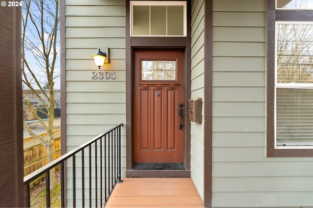 doorway to property with fence