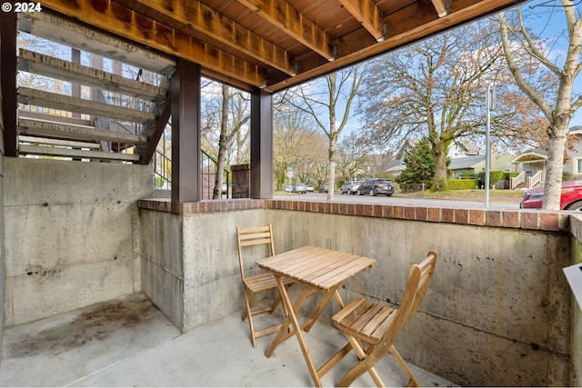 view of patio / terrace featuring a residential view and outdoor dining space