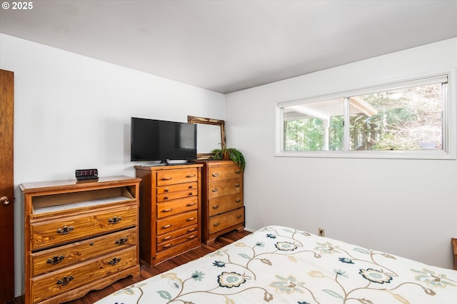 bedroom with wood finished floors