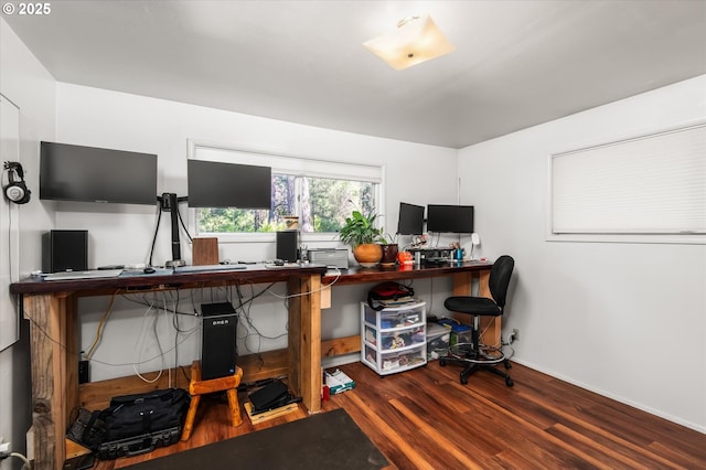 office space featuring baseboards and wood finished floors