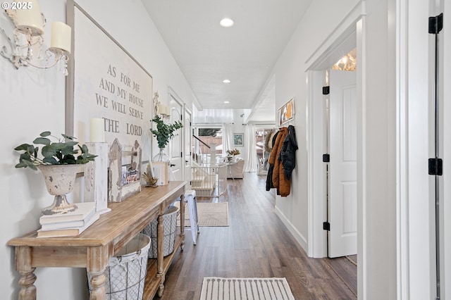 hallway with dark hardwood / wood-style floors