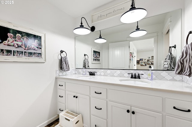 bathroom with vanity and backsplash