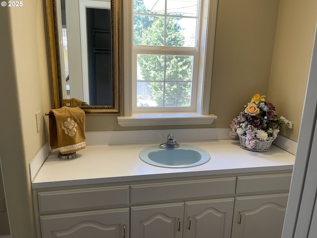 bathroom featuring vanity and plenty of natural light