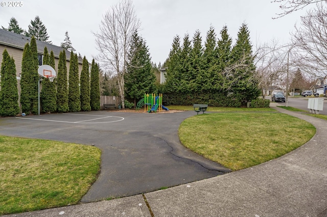 view of sport court featuring playground community, a yard, and community basketball court